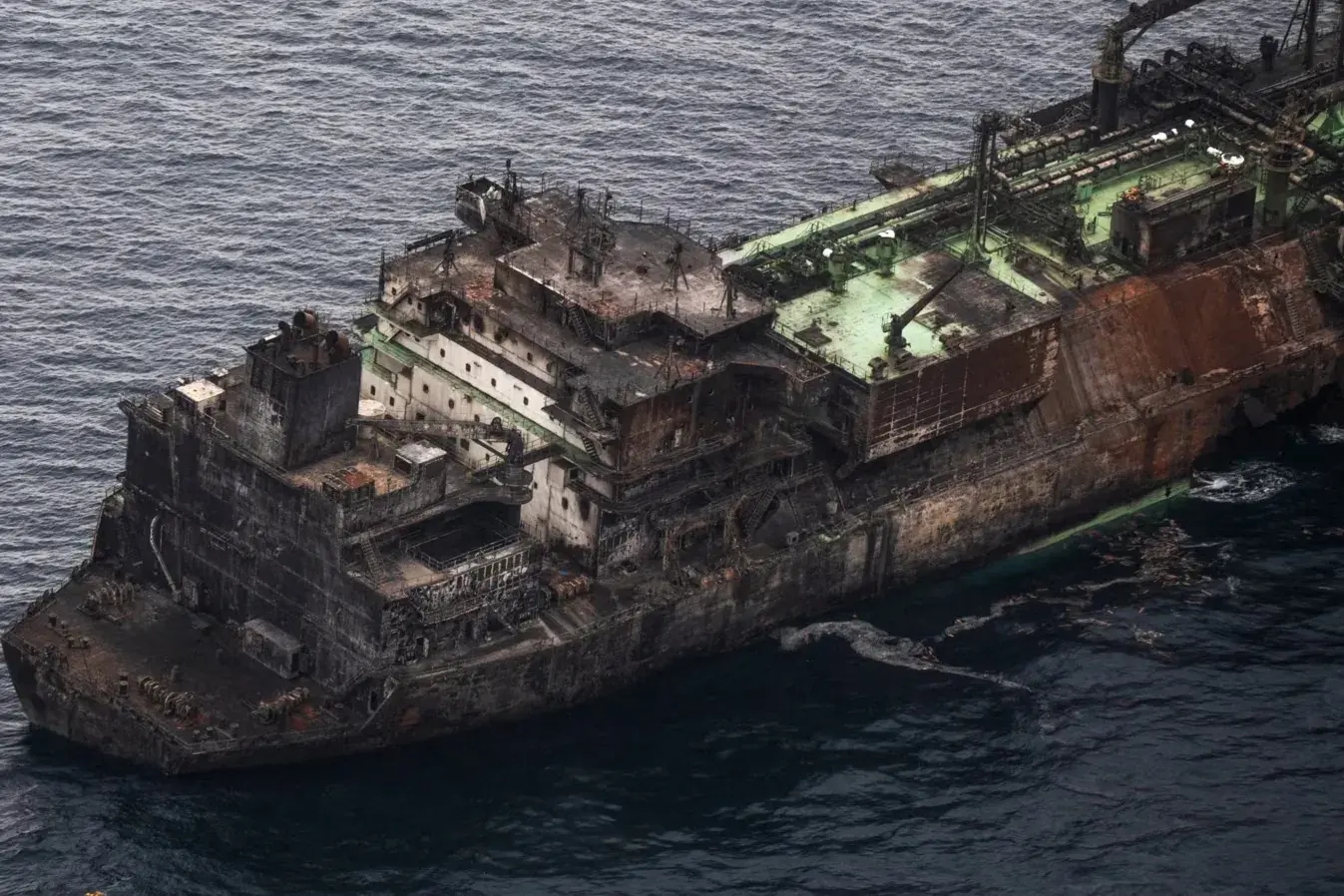 The charred hull of the sanctioned Russian LNG carrier Arctic Metagaz pictured floating in the Mediterranean Sea after reportedly being attacked by a Ukrainian sea drone on March 3. Photo: AFP